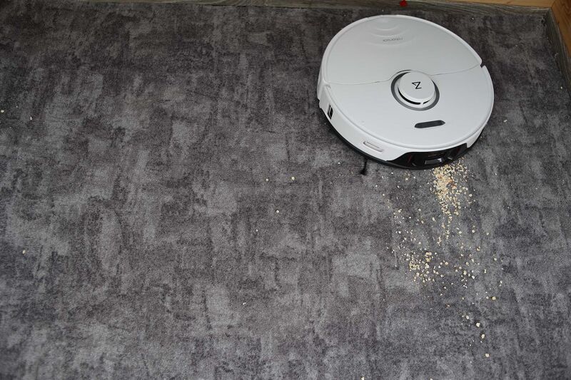 Vacuuming oatmeal on short pile carpet